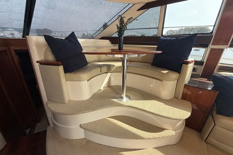 Slide: The Image of Luxurious interior of a 2009 Meridian 391 Sedan yacht with elegant seating and table. - 12
