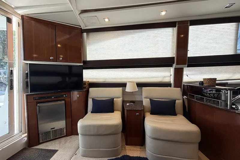 Slide: The Image of Luxurious interior of a 2009 Meridian 391 Sedan yacht with plush seating and modern amenities. - 11