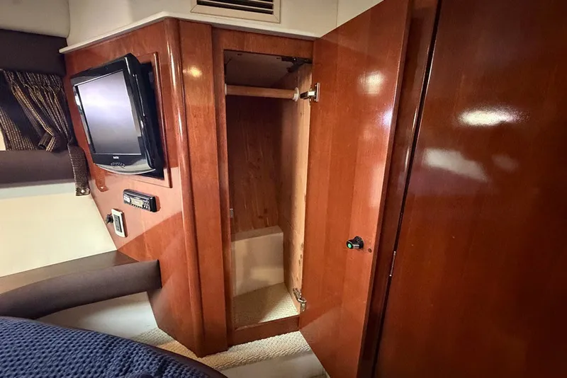 Slide: The Image of Interior of 2009 Meridian 391 Sedan with TV, open wooden cabinet, and cozy furnishings. - 20
