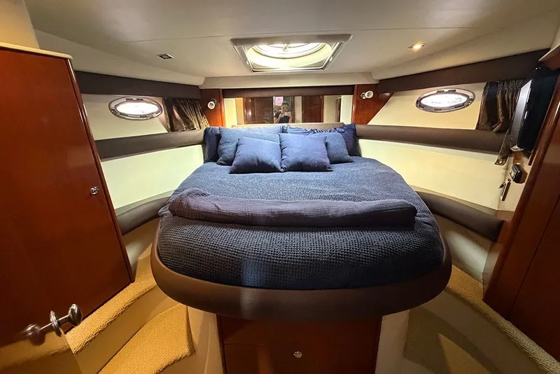 Slide: The Image of Luxurious bedroom interior of 2009 Meridian 391 Sedan yacht with plush bedding. - 19