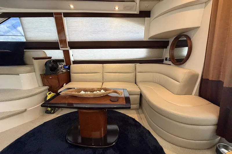 Slide: The Image of Luxurious interior of a 2009 Meridian 391 Sedan yacht with plush seating and elegant decor. - 9