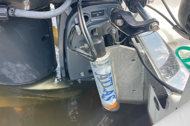 Slide: The Image of Close-up of 2019 Robalo 246 Cayman boat engine with Atlas hydraulic jack plate. - 13