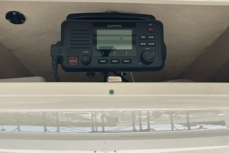 Slide: The Image of Garmin marine radio installed on a 2019 Robalo 246 Cayman boat. - 36