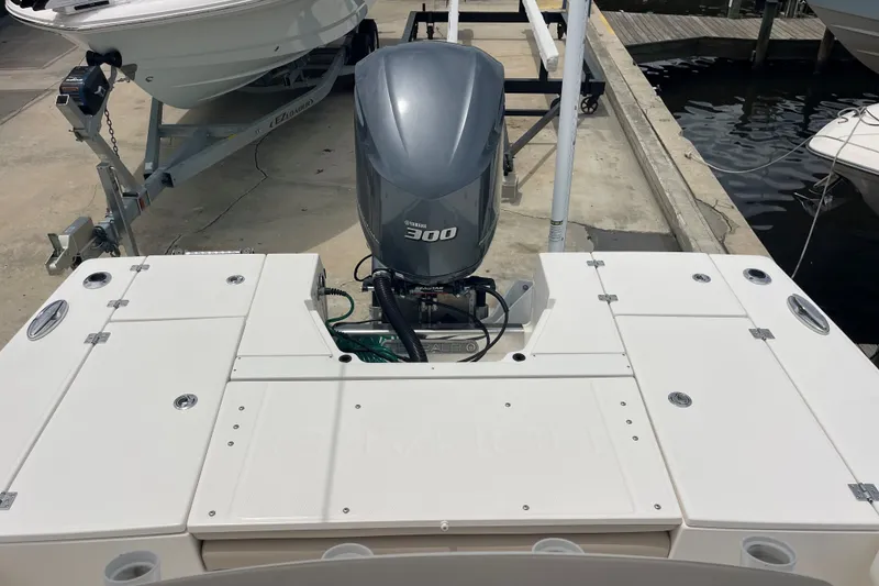 Slide: The Image of 2019 Robalo 246 Cayman boat with Yamaha 300 engine at dockside. - 21