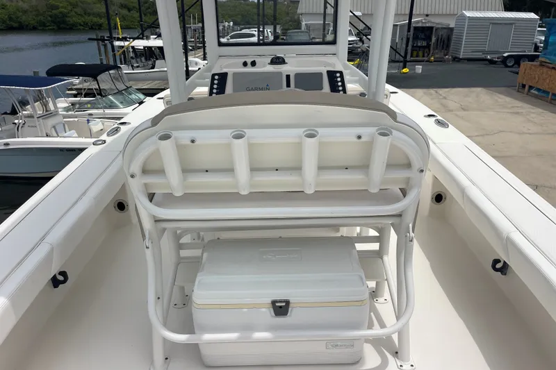 Slide: The Image of 2019 Robalo 246 Cayman boat interior with seating and storage. - 23