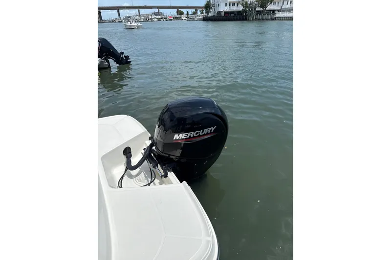 Slide: The Image of 2023 Bayliner VR6 Bowrider OB with Mercury outboard motor on calm water. - 9