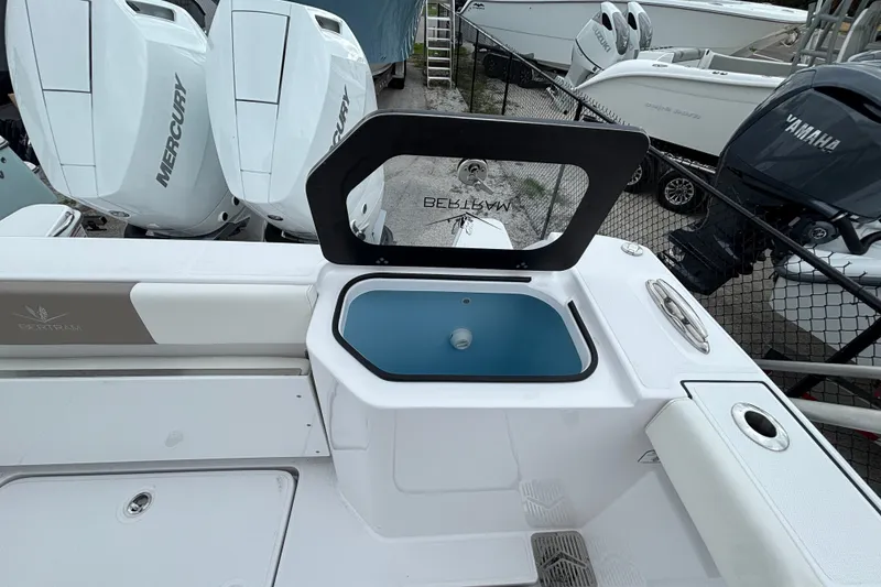 Slide: The Image of 2027 Bertram 34 CC boat with Mercury and Yamaha engines, featuring a livewell. - 18