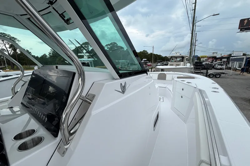 Slide: The Image of 2027 Bertram 34 CC boat with sleek design and modern dashboard controls. - 22