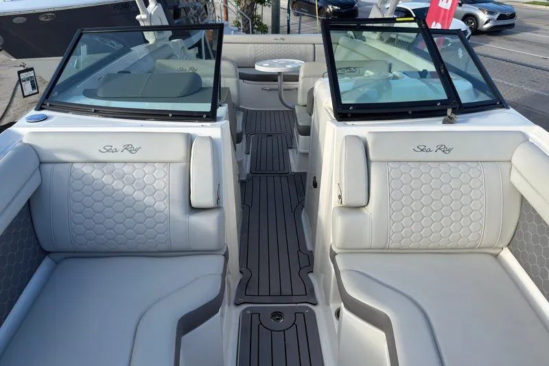 Slide: The Image of 2021 Sea Ray SDX 270 boat interior with luxurious seating and modern design. - 12