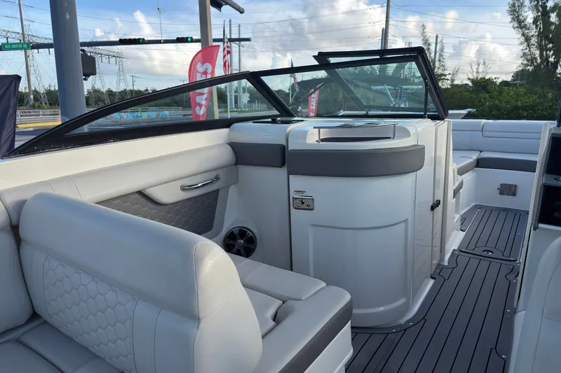 Slide: The Image of 2021 Sea Ray SDX 270 boat interior with sleek seating and modern design. - 6