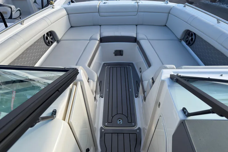 Slide: The Image of Interior view of 2021 Sea Ray SDX 270 boat with spacious seating and modern design. - 11