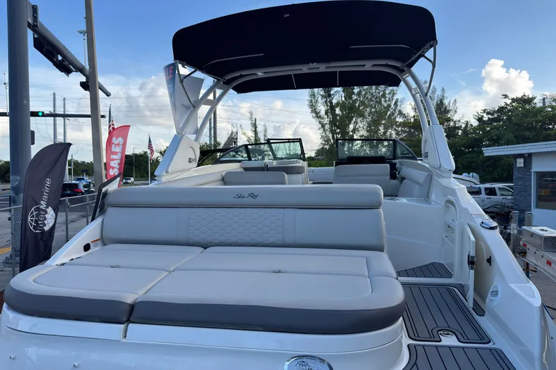 Slide: The Image of 2021 Sea Ray SDX 270 boat with spacious seating and sleek design at a sales event. - 3