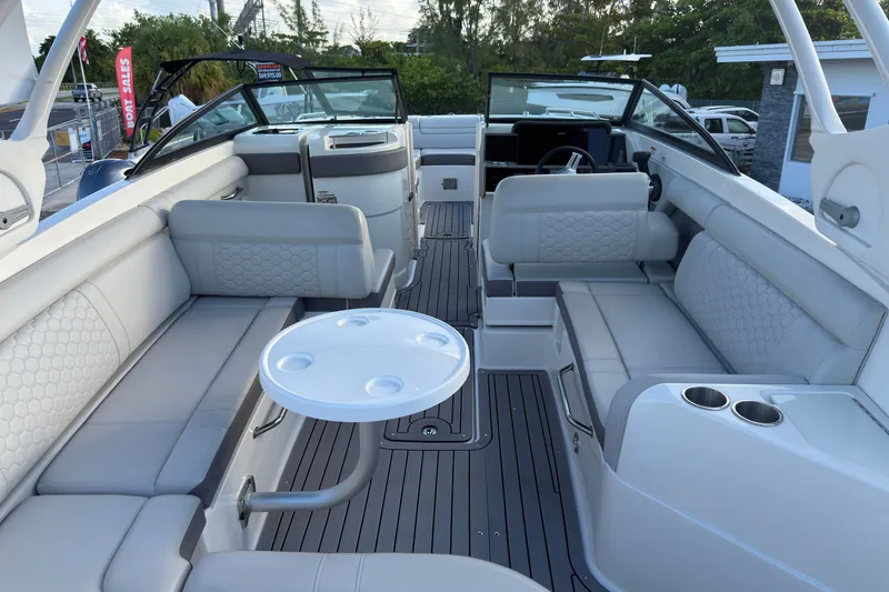 Slide: The Image of 2021 Sea Ray SDX 270 boat interior with spacious seating and modern design. - 4
