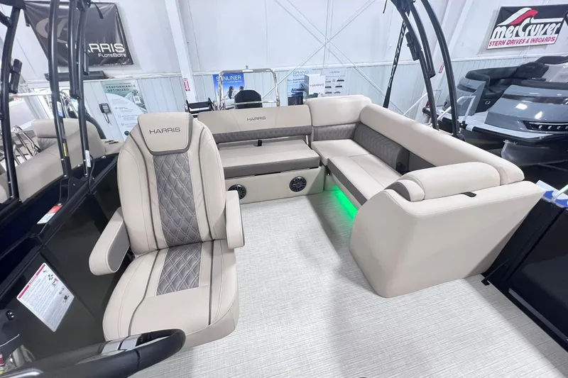 Slide: The Image of 2026 Harris Cruiser 250 interior with beige seating and modern design. - 23