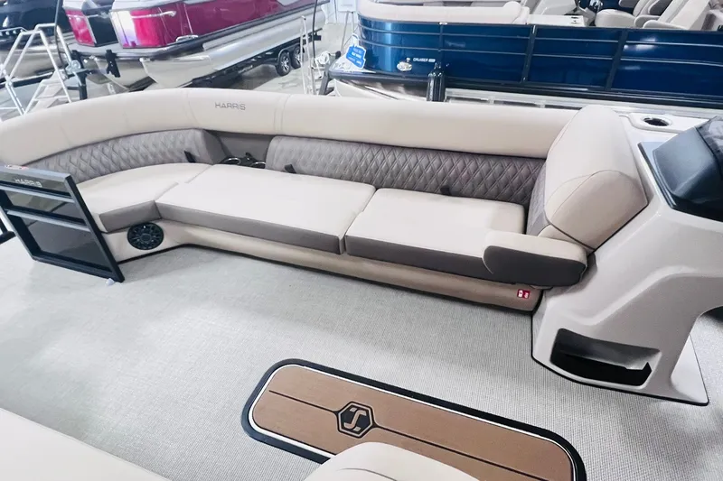 Slide: The Image of 2026 Harris Cruiser 250 interior with luxurious seating and modern design. - 10