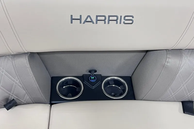Slide: The Image of 2026 Harris Cruiser 250 boat seat with cup holders and USB port. - 31