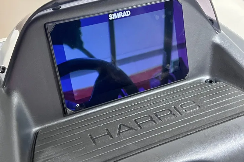 Slide: The Image of 2026 Harris Cruiser 250 dashboard with Simrad display screen. - 17