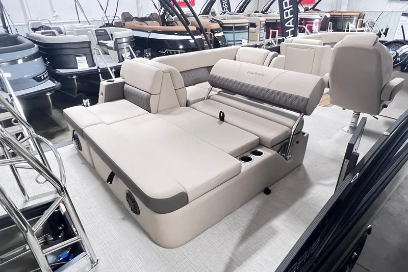 Slide: The Image of 2026 Harris Cruiser 250 boat interior with luxurious seating and cup holders. - 27
