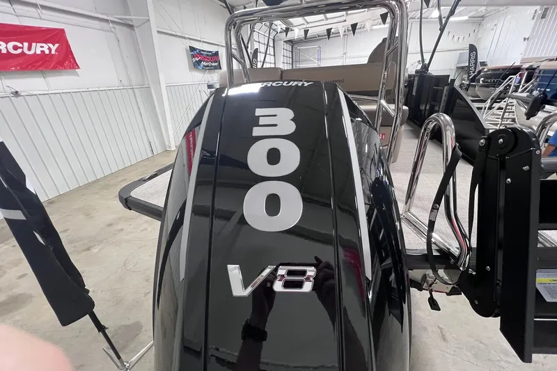 Slide: The Image of 2026 Harris Cruiser 250 with Mercury 300 V8 engine in showroom. - 36