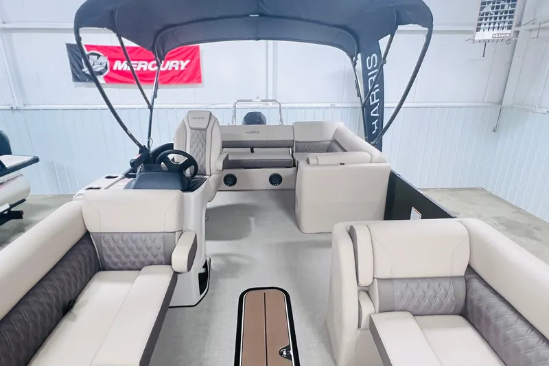 Slide: The Image of 2026 Harris Cruiser 250 pontoon boat interior with plush seating and canopy. - 8