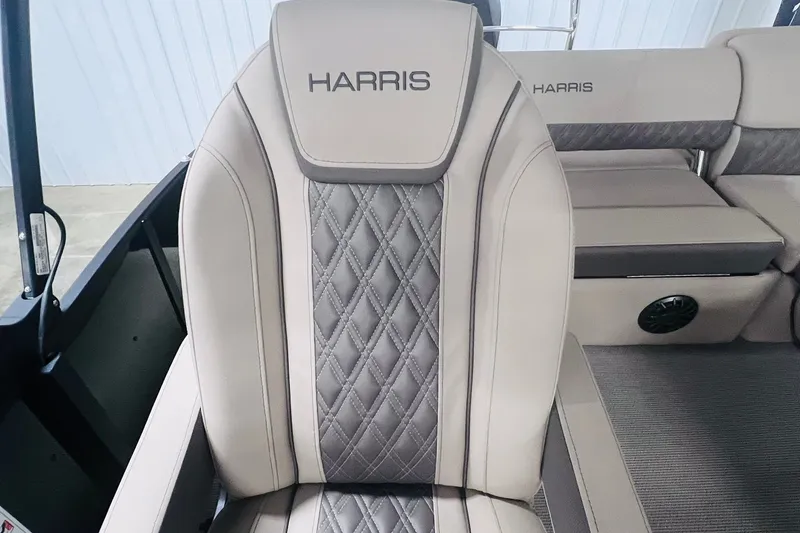 Slide: The Image of Luxurious seating on 2026 Harris Cruiser 250 boat, featuring elegant diamond stitching. - 21