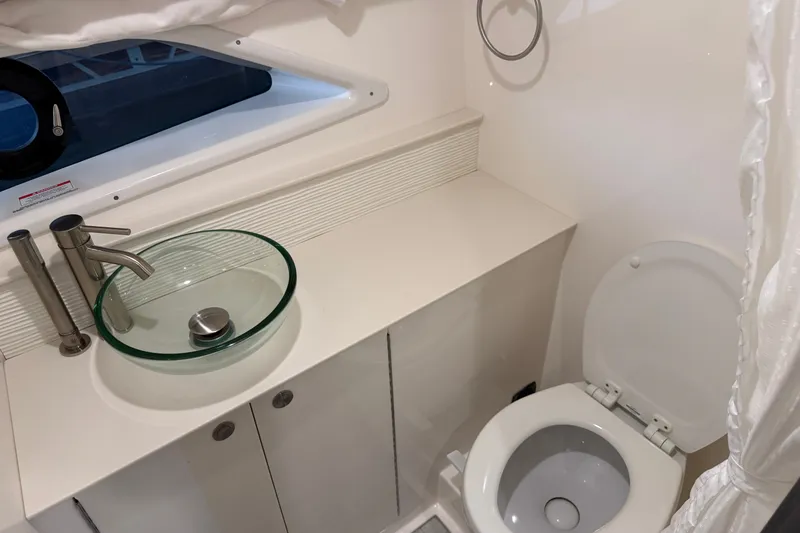 Slide: The Image of Modern bathroom in 2025 Sea Ray Sundancer 320 yacht with glass sink and toilet. - 31