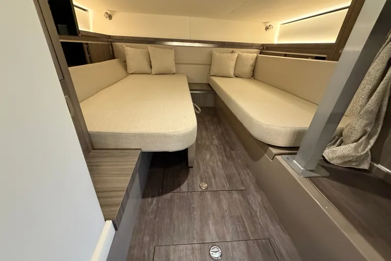 Slide: The Image of Interior of 2025 Sea Ray Sundancer 320, featuring cozy seating and modern design. - 32