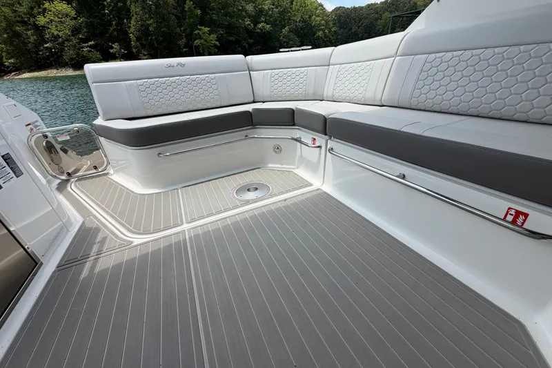 Slide: The Image of 2025 Sea Ray Sundancer 320 boat interior with sleek seating and modern design. - 23