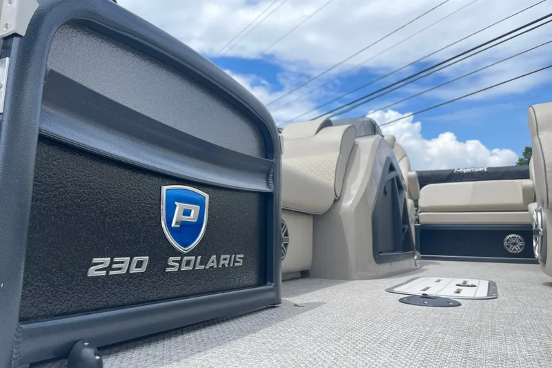 Slide: The Image of 2023 Premier SOLARIS 230 RL PTX pontoon boat interior with logo and seating. - 25