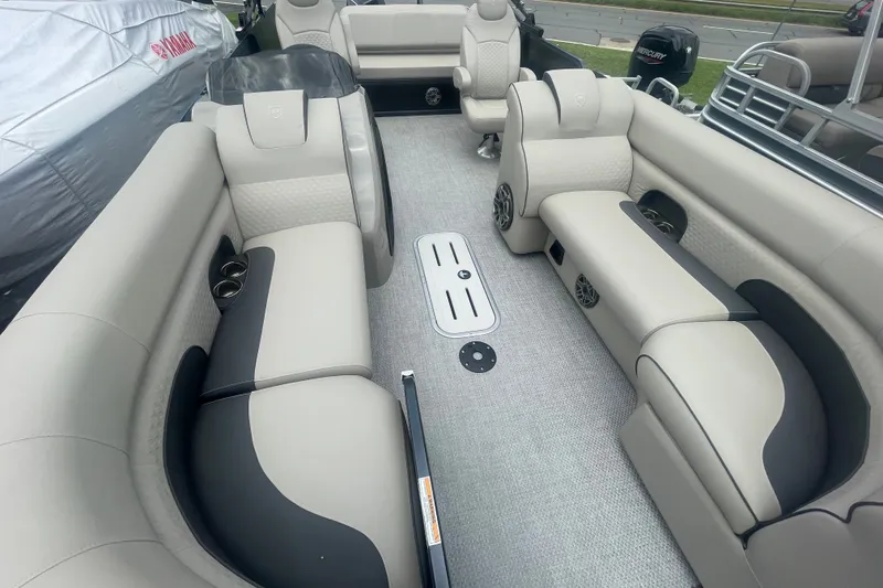 Slide: The Image of 2023 Premier SOLARIS 230 RL PTX pontoon boat interior with luxurious seating and modern design. - 5