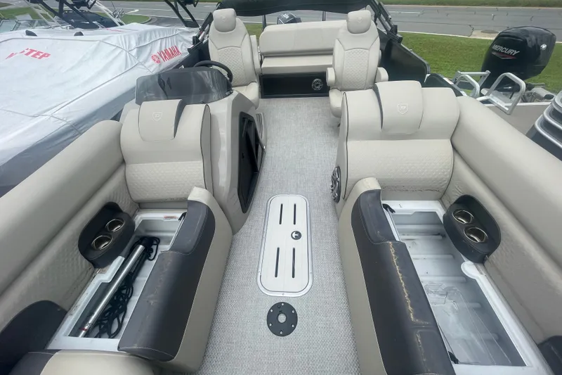 Slide: The Image of Interior of 2023 Premier SOLARIS 230 RL PTX boat with luxurious seating and storage compartments. - 6