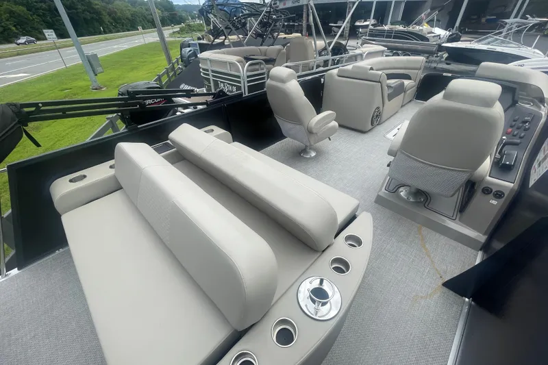 Slide: The Image of 2023 Premier SOLARIS 230 RL PTX pontoon boat interior with luxurious seating and modern controls. - 20