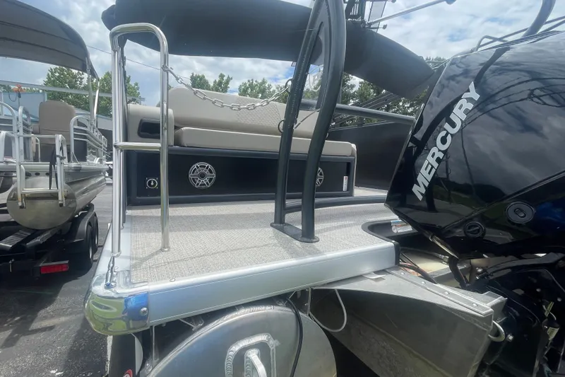 Slide: The Image of 2023 Premier SOLARIS 230 RL PTX pontoon boat with Mercury engine, docked outdoors. - 22