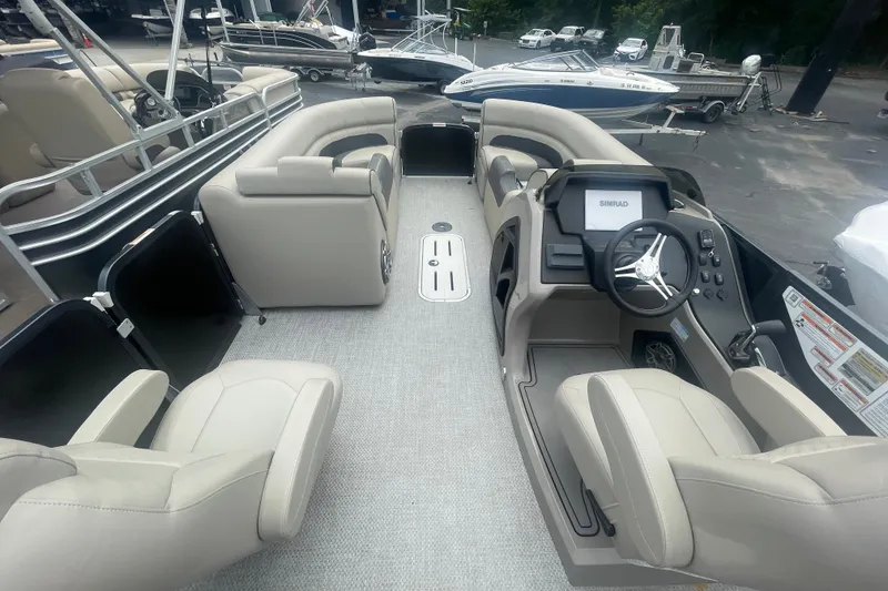Slide: The Image of Interior view of 2023 Premier SOLARIS 230 RL PTX pontoon boat with luxurious seating and modern dashboard. - 14