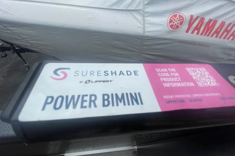 Slide: The Image of SureShade Power Bimini label on Premier SOLARIS 230 RL PTX, 2023 model, with Yamaha cover. - 16