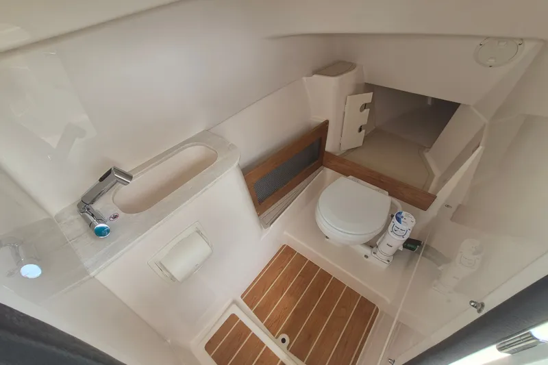 Slide: The Image of 2027 Grady-White Freedom 285 boat interior with modern bathroom amenities. - 13