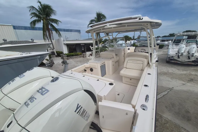 Slide: The Image of 2027 Grady-White Freedom 285 boat with Yamaha engines, docked outdoors. - 20
