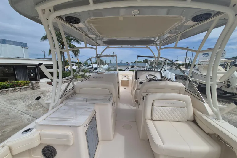 Slide: The Image of 2027 Grady-White Freedom 285 boat interior with luxurious seating and modern helm. - 19