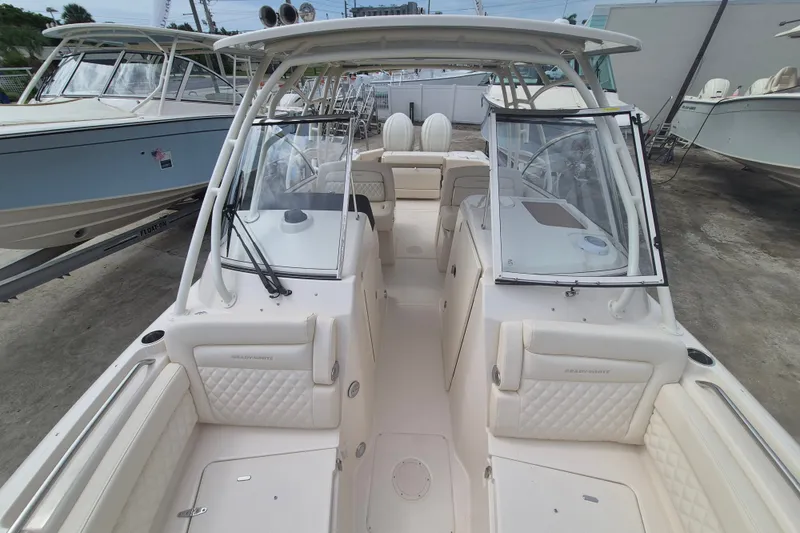 Slide: The Image of 2027 Grady-White Freedom 285 boat interior, featuring spacious seating and modern design. - 4