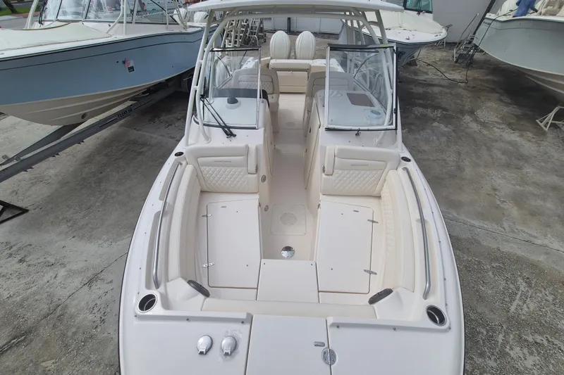 Slide: The Image of 2027 Grady-White Freedom 285 boat with spacious seating and modern design. - 5