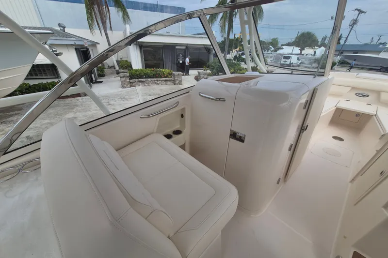 Slide: The Image of 2027 Grady-White Freedom 285 boat interior with sleek seating and modern design. - 12
