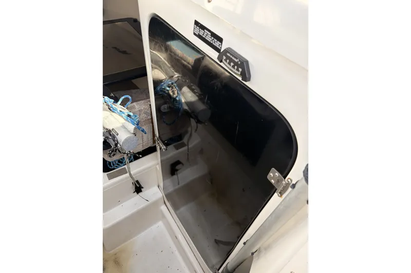 Slide: The Image of 2000 MacGregor 26X cabin entrance with ropes and equipment visible. - 14