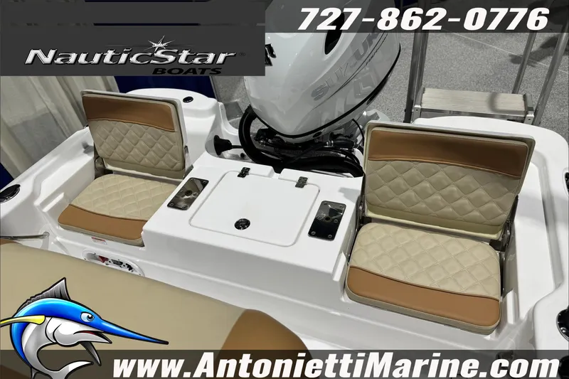 Slide: The Image of 2025 NauticStar 194 Bay boat interior with cushioned seats and Suzuki engine. - 23