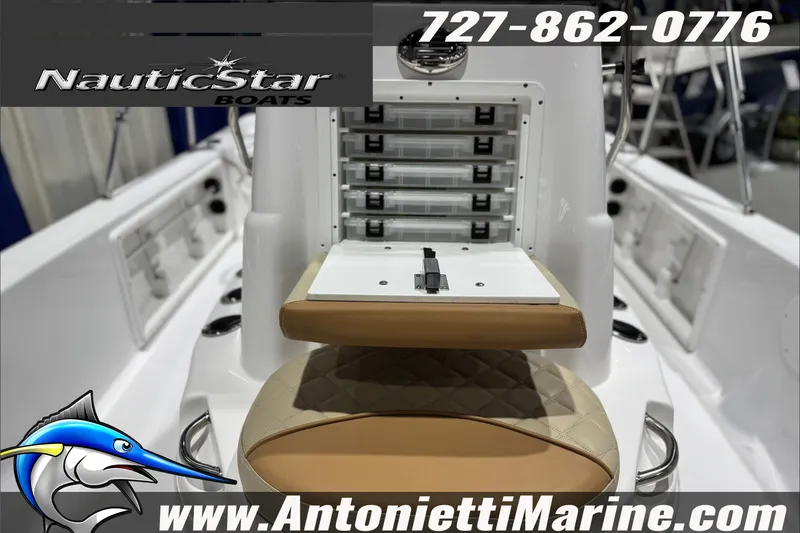 Slide: The Image of 2025 NauticStar 194 Bay boat interior with storage compartments and seating. - 14