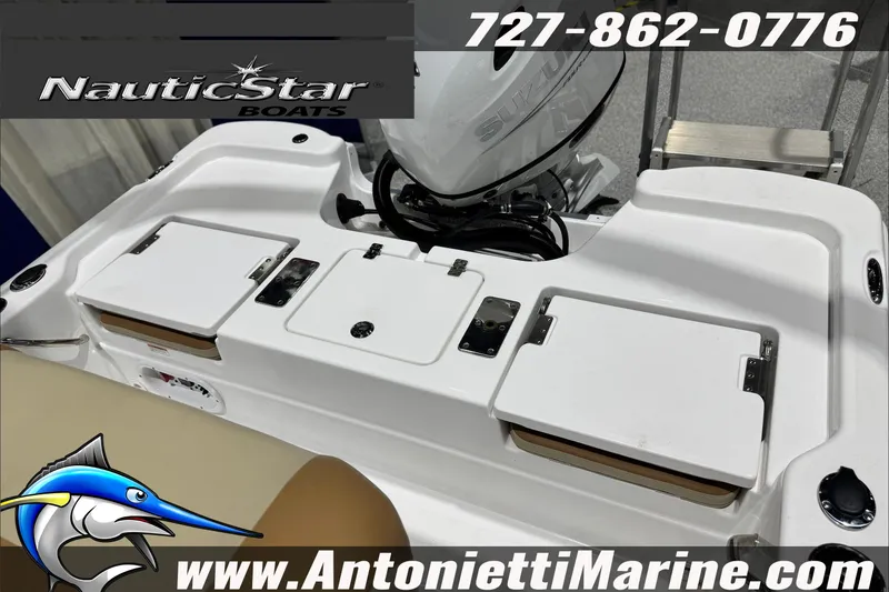 Slide: The Image of 2025 NauticStar 194 Bay boat with Suzuki engine, featuring storage compartments and marine branding. - 22