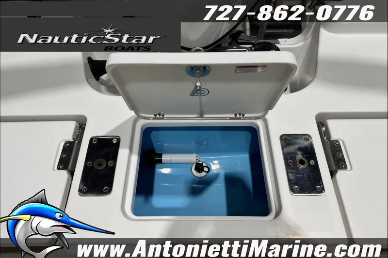 Slide: The Image of 2025 NauticStar 194 Bay boat livewell, featuring open hatch and marine hardware. - 24
