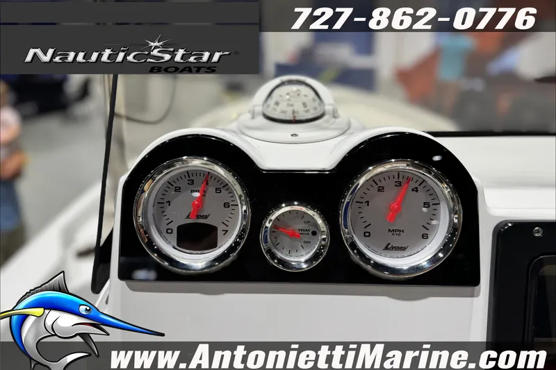 Slide: The Image of Dashboard of 2025 NauticStar 194 Bay boat with gauges and contact information. - 17