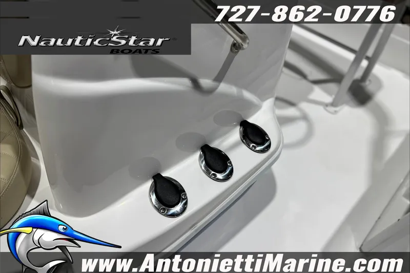Slide: The Image of 2025 NauticStar 194 Bay boat interior with control switches, featuring branding and contact details. - 16