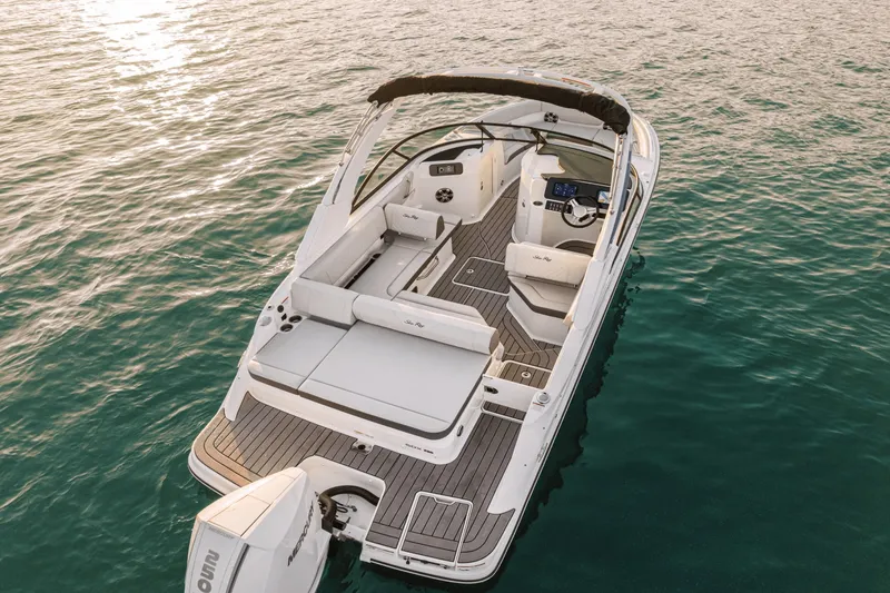 Slide: The Image of The image shows a 2027 Sea Ray SDX 230 Outboard boat on calm water. - 6