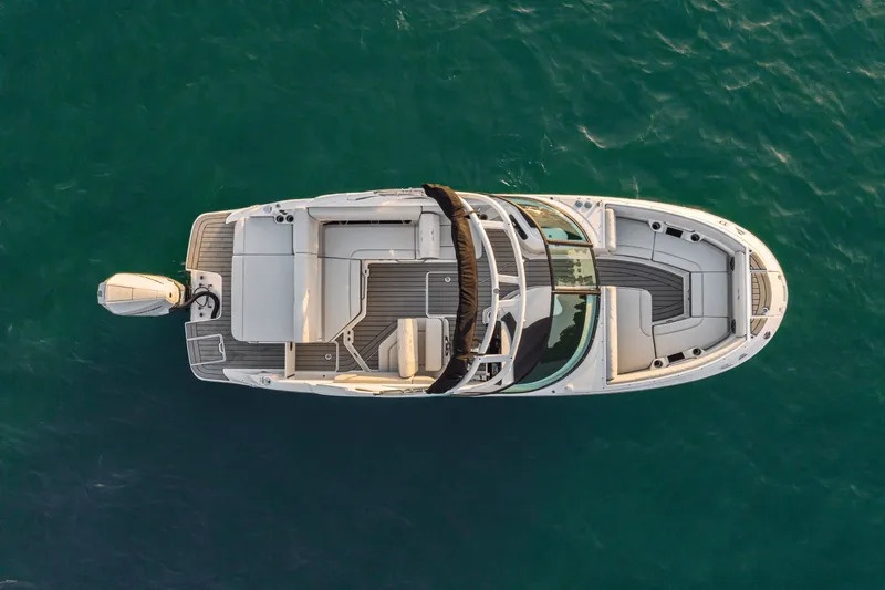 Slide: The Image of Aerial view of a 2027 Sea Ray SDX 230 Outboard on calm water. - 7